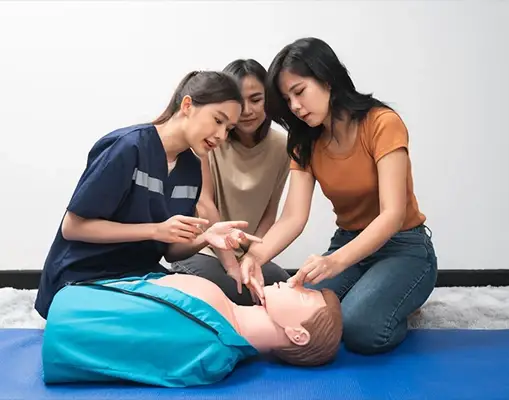 Three Women Practicing CPR on Mannequin During CPR Classes Los Angeles, CA