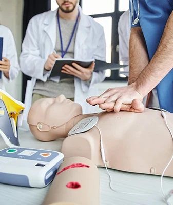 Medical Professionals Practicing CPR on a Mannequin in Los Angeles, CA Training